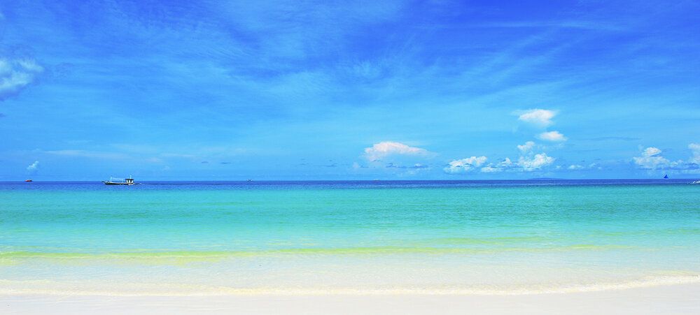 White sand beach mural with blue sea and sky, ideal for indoor and outdoor spaces.