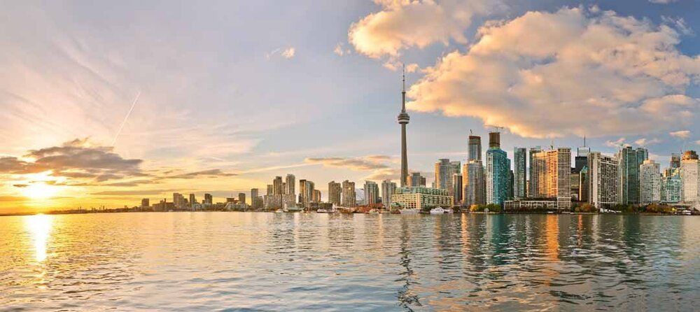 Toronto skyline mural at sunset with warm reflections, ideal for indoor and outdoor spaces.