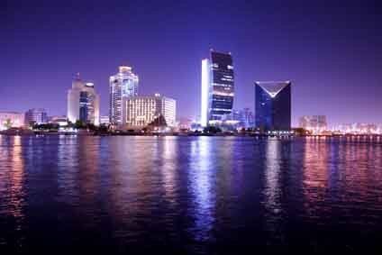 Dubai night skyline mural with evening lights, perfect for indoor and outdoor spaces.