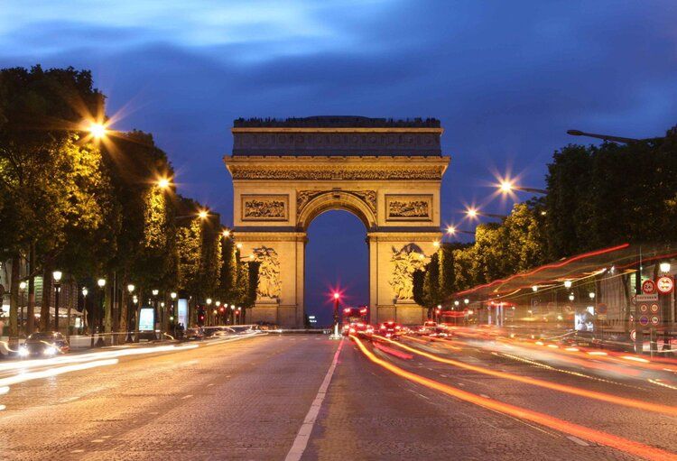 Arc de Triomphe mural lit by Paris city lights, ideal for indoor and outdoor spaces.