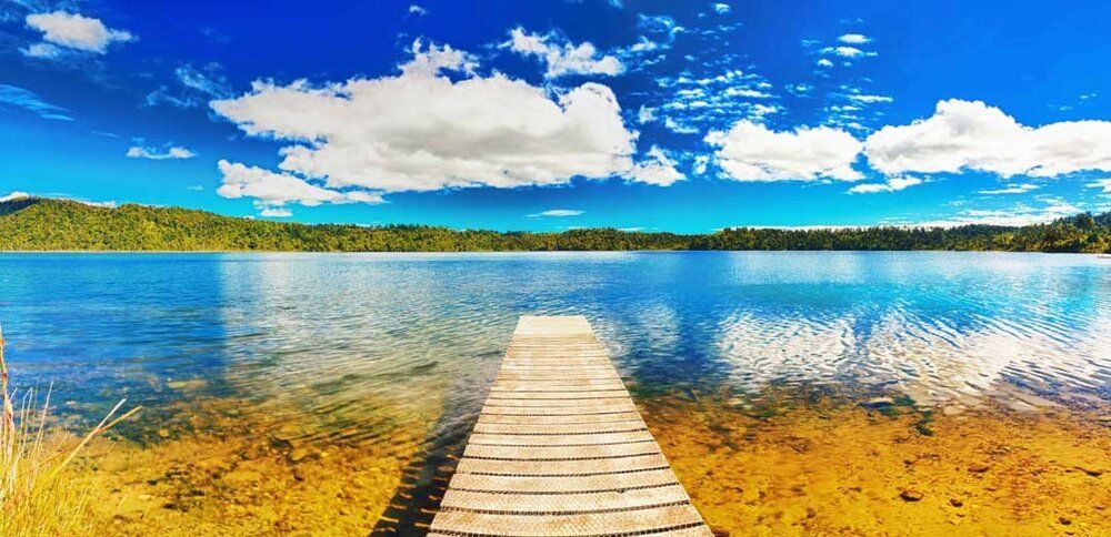 New Zealand lake mural with wooden dock, ideal for indoor and outdoor spaces.