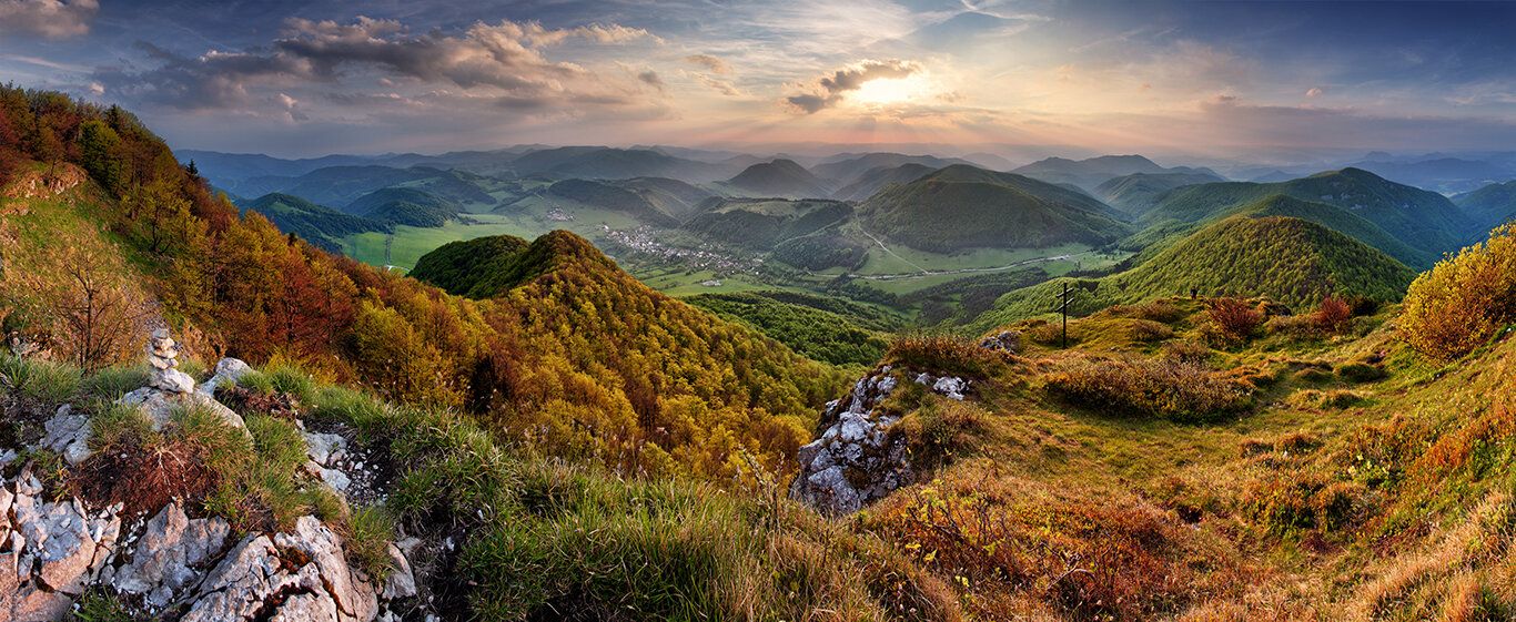 Slovak mountain mural with green hills, sunlight, and cross, ideal for indoor and outdoor spaces.