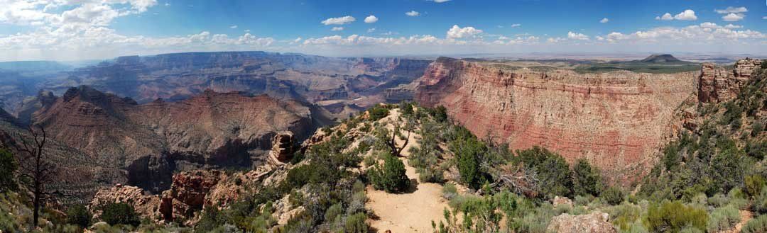 Panoramic canyon edge view with rock formations, perfect for indoor and outdoor spaces.