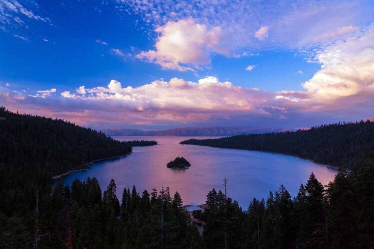 Sunset mural of Emerald Bay, Lake Tahoe with Sierra Nevada mountains, perfect for indoor and outdoor spaces.