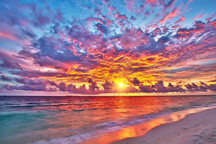 Vibrant Maldivian sunset mural over ocean, perfect for indoor and outdoor spaces.