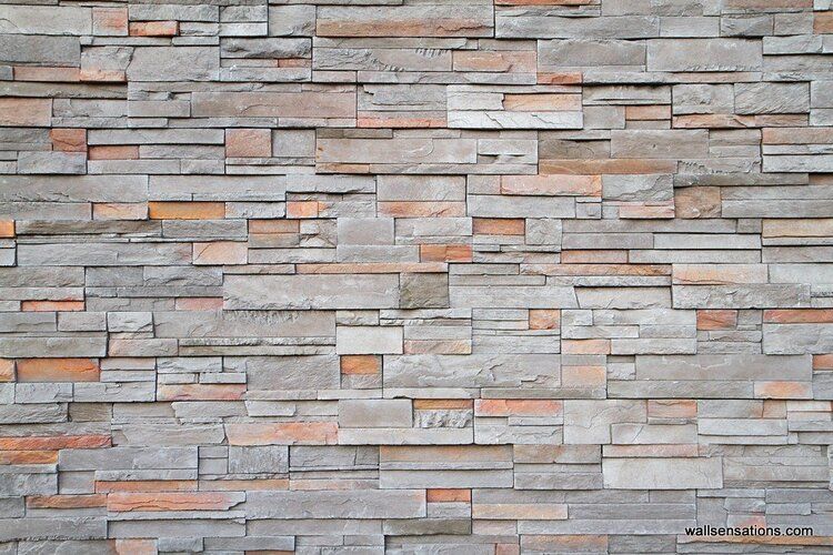 stone wall mural with gray, brown, and red stones in a natural random pattern.