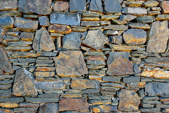 Ancient monastery stone wall, perfect for enhancing both indoor and outdoor spaces.