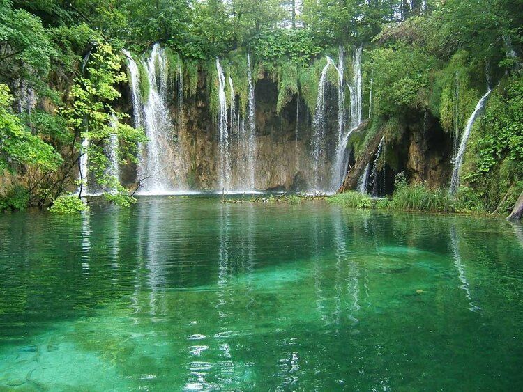 Wall mural of Plitvice Lakes' terraced waterfalls and lakes, perfect for indoor and outdoor spaces.