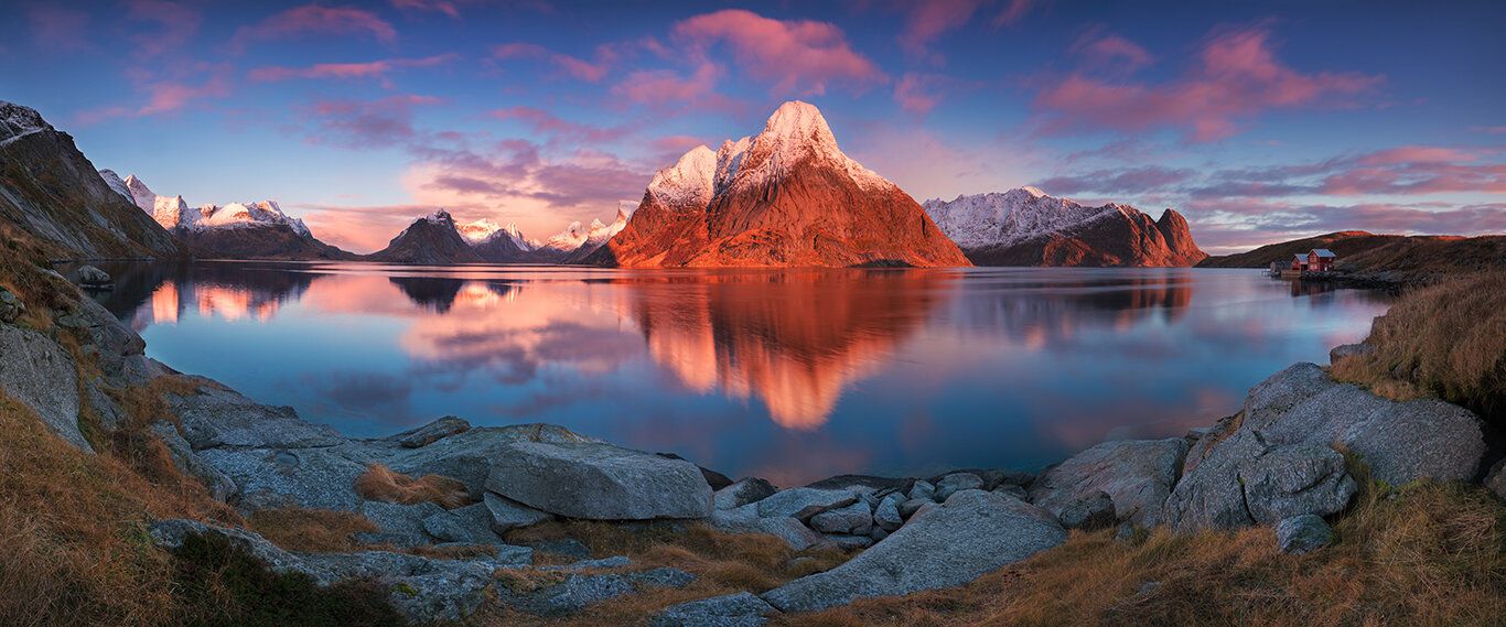 Panoramic view of Lofoten Islands at sunrise, with mountains and fjords, ideal for wall art.