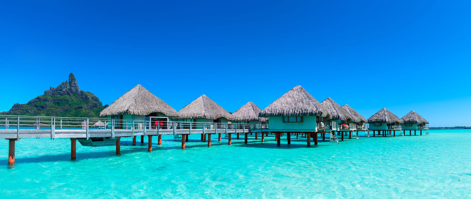 Panoramic mural of Bora Bora's overwater bungalows, perfect for creating a tropical vibe indoors or outdoors.
