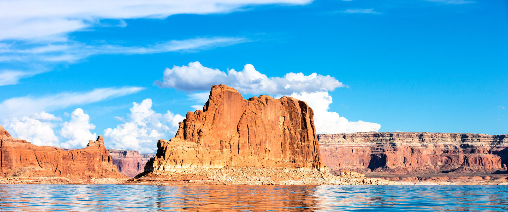 Panoramic Lake Powell mural with blue waters and rock formations, ideal for indoor and outdoor spaces.