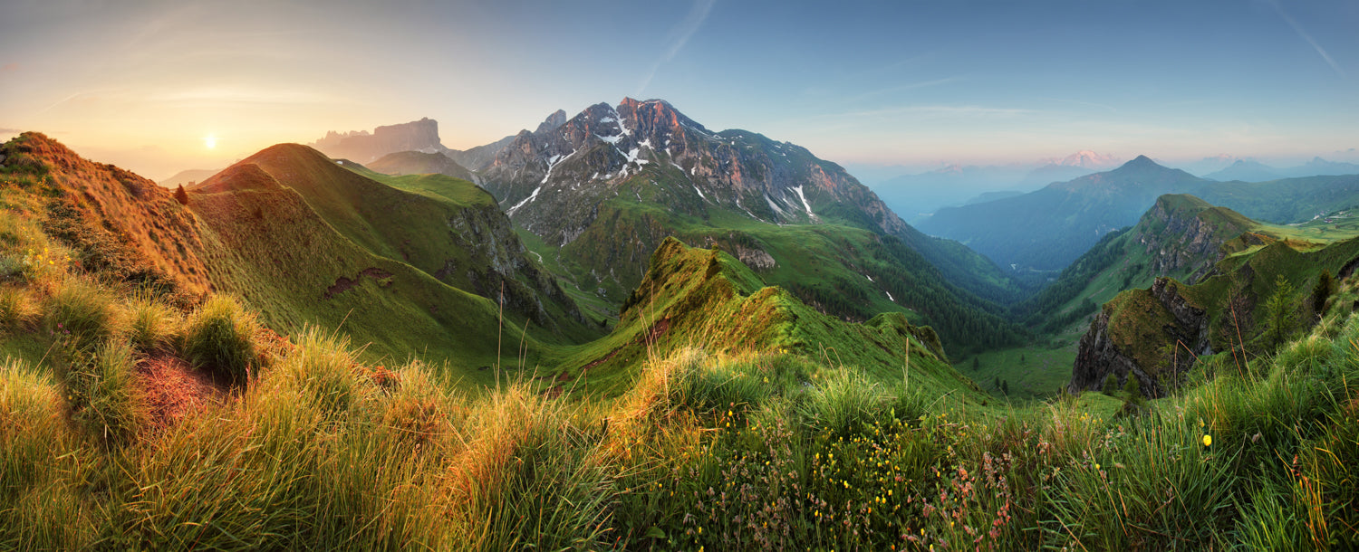 Panoramic sunrise mural over Dolomite mountains, perfect for indoor and outdoor spaces.