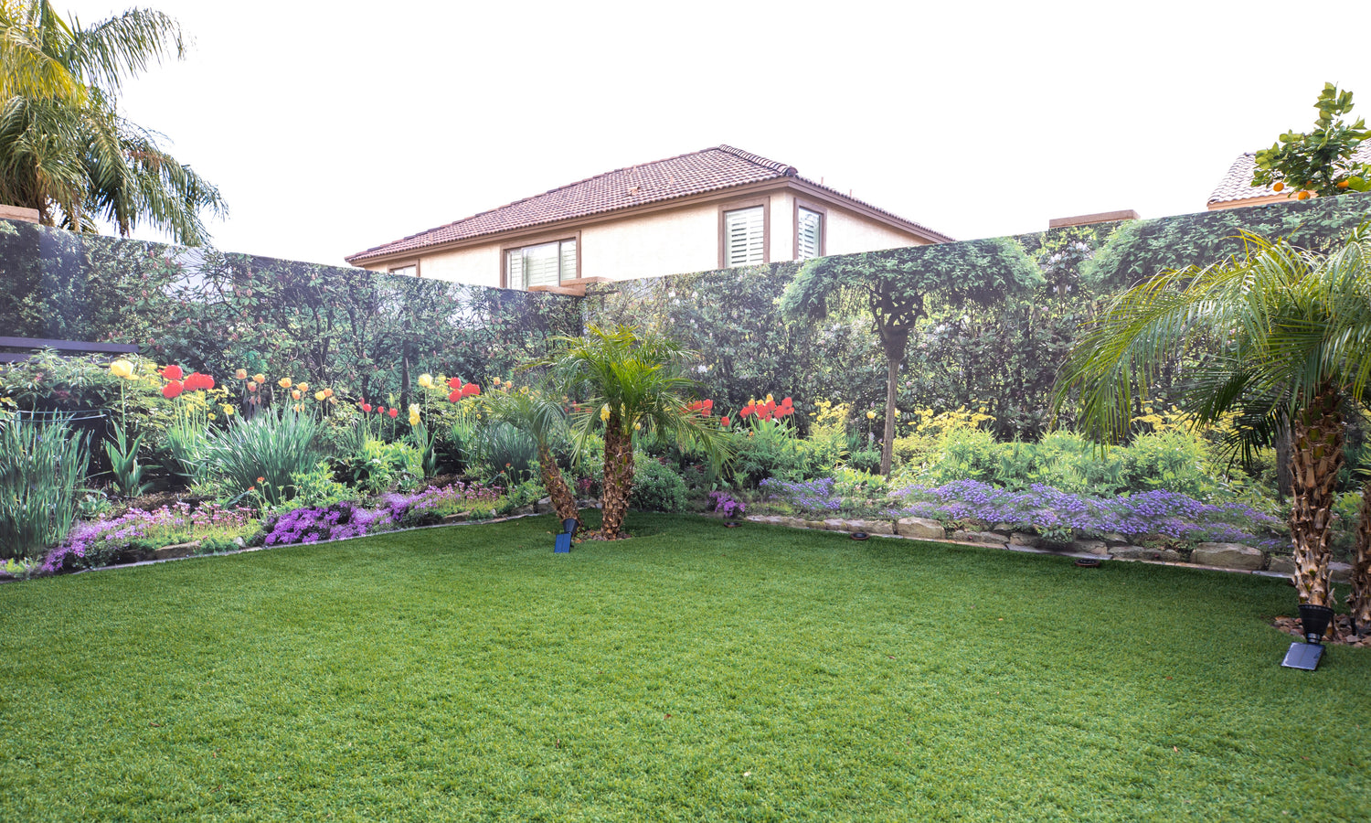 Floral tulip garden outdoor mural in residential backyard patio