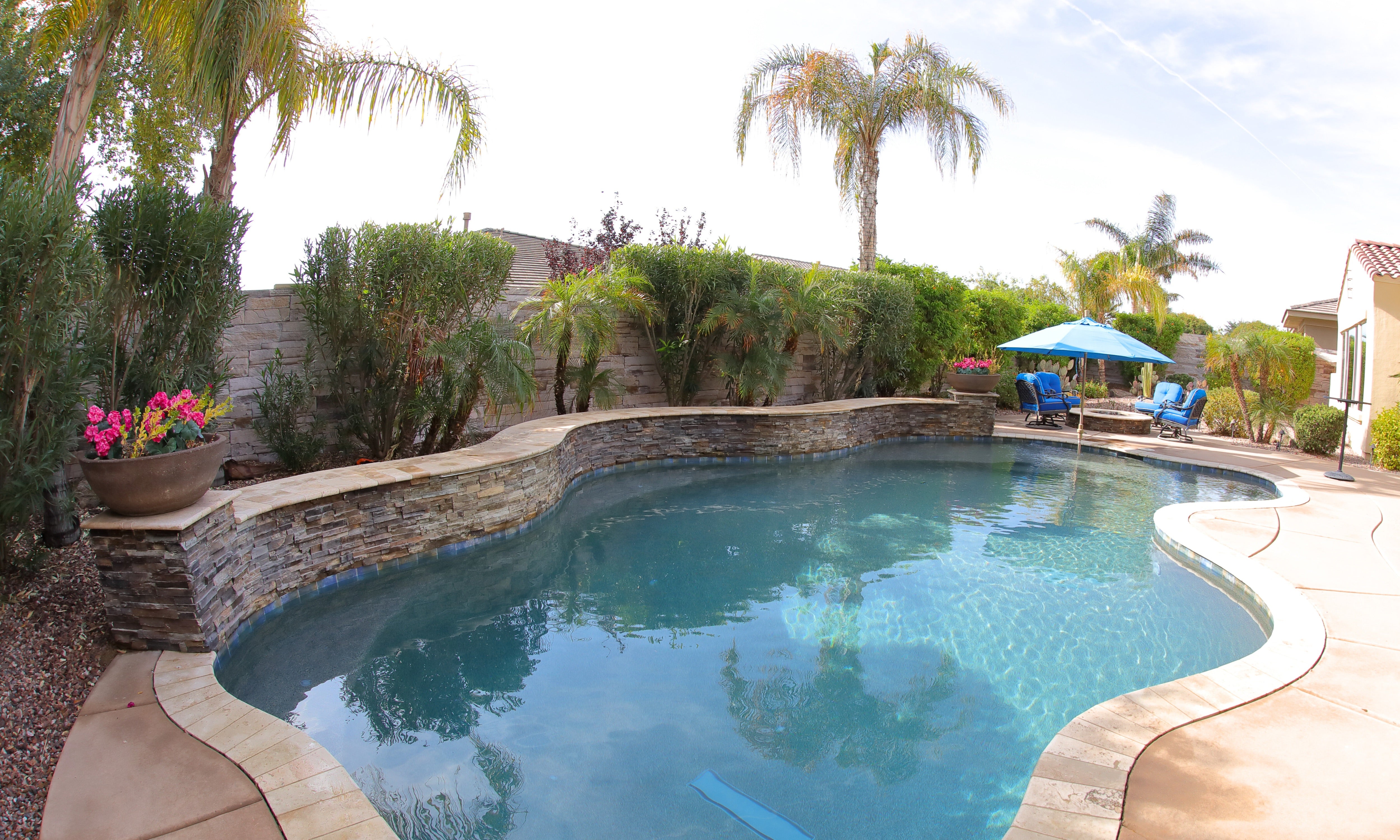 Residential backyard pool with brick texture outdoor wall mural